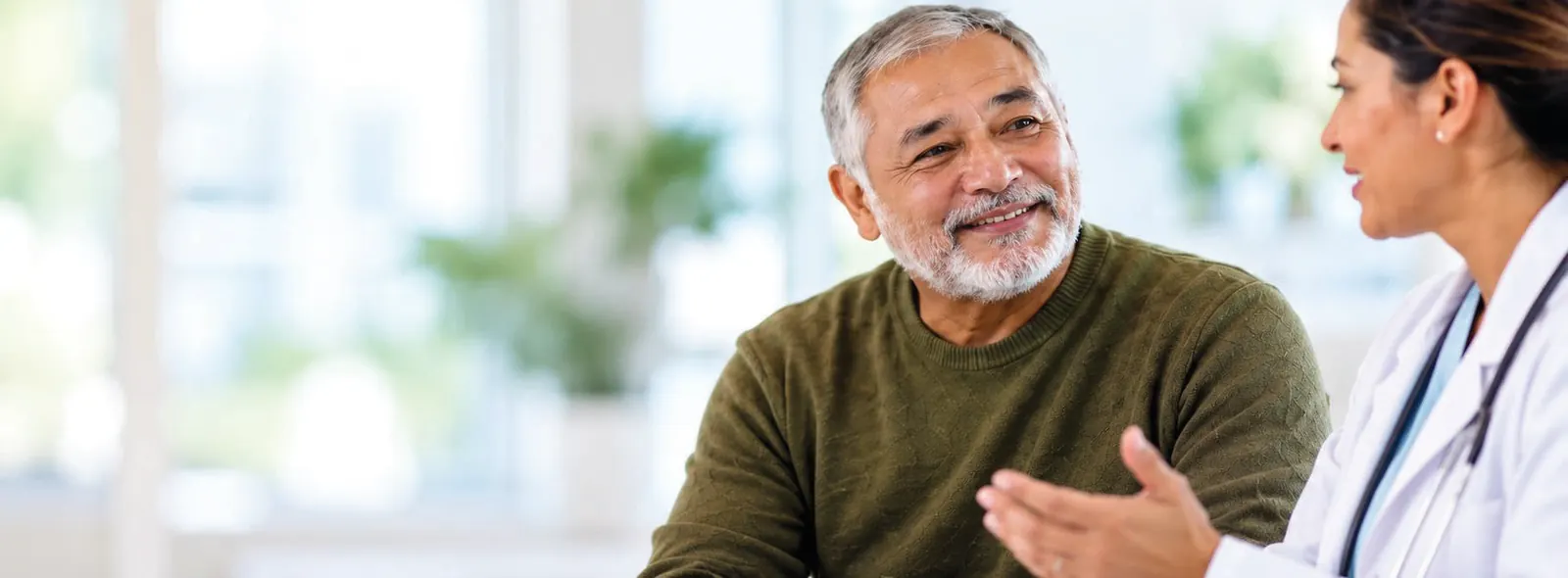 A man with multiple myeloma talking with his doctor